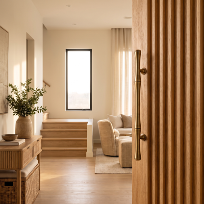Brass handle on a fluted oak wardrobe door