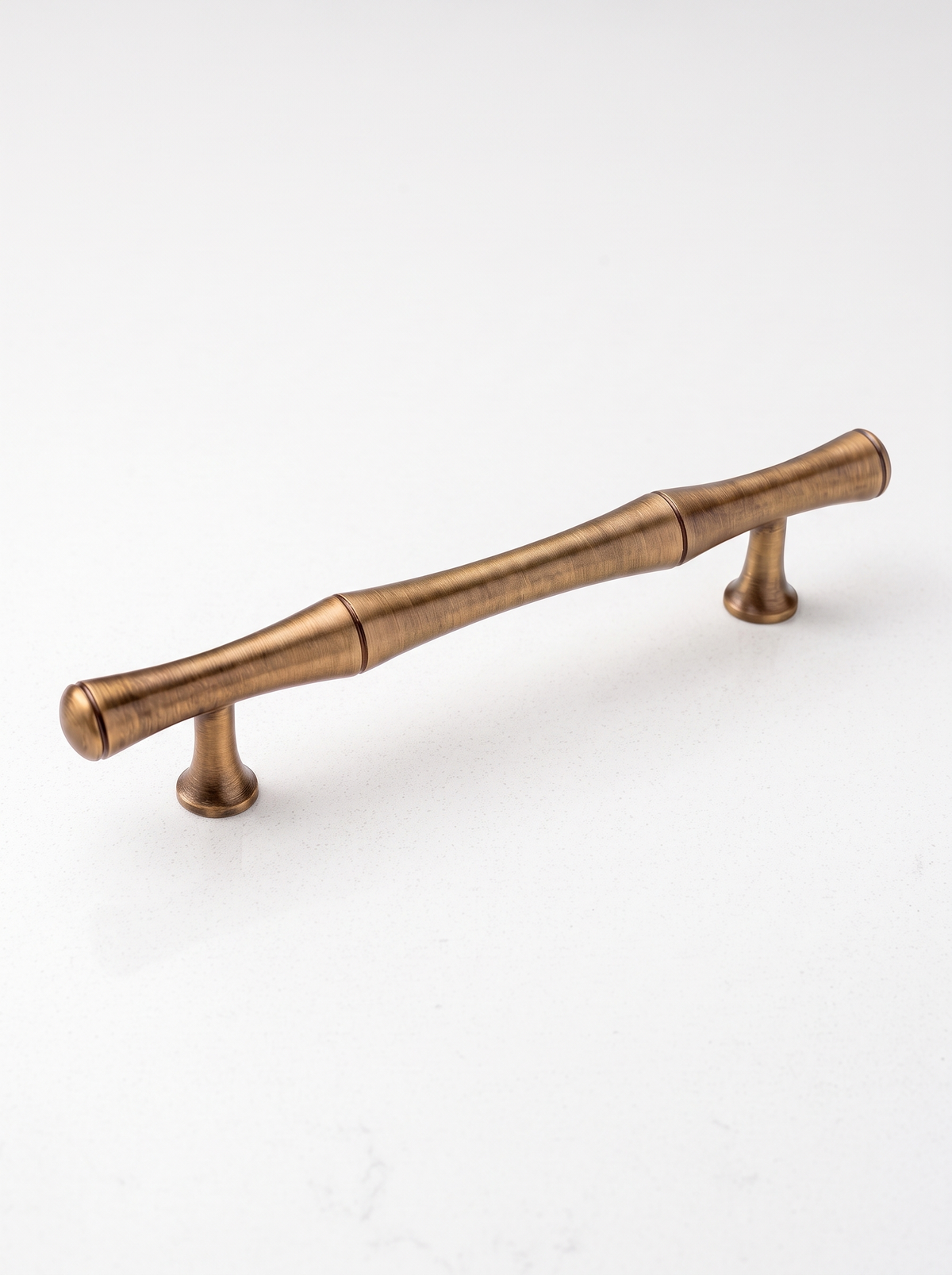 Rennick brass handle on a white counter