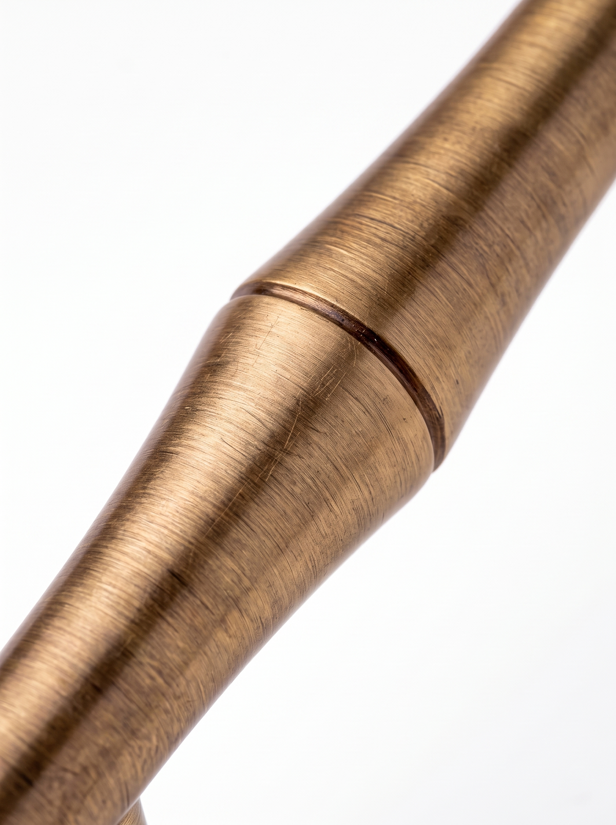 Macro of the Rennick brass handle brushed finish