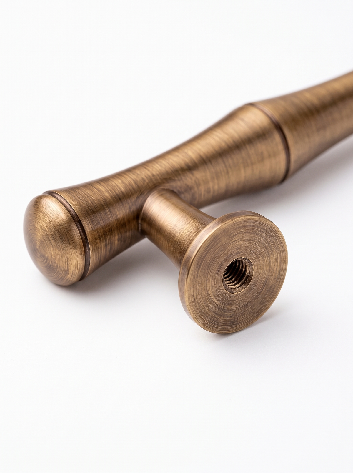 Close view of the brass handle raised base and fixing